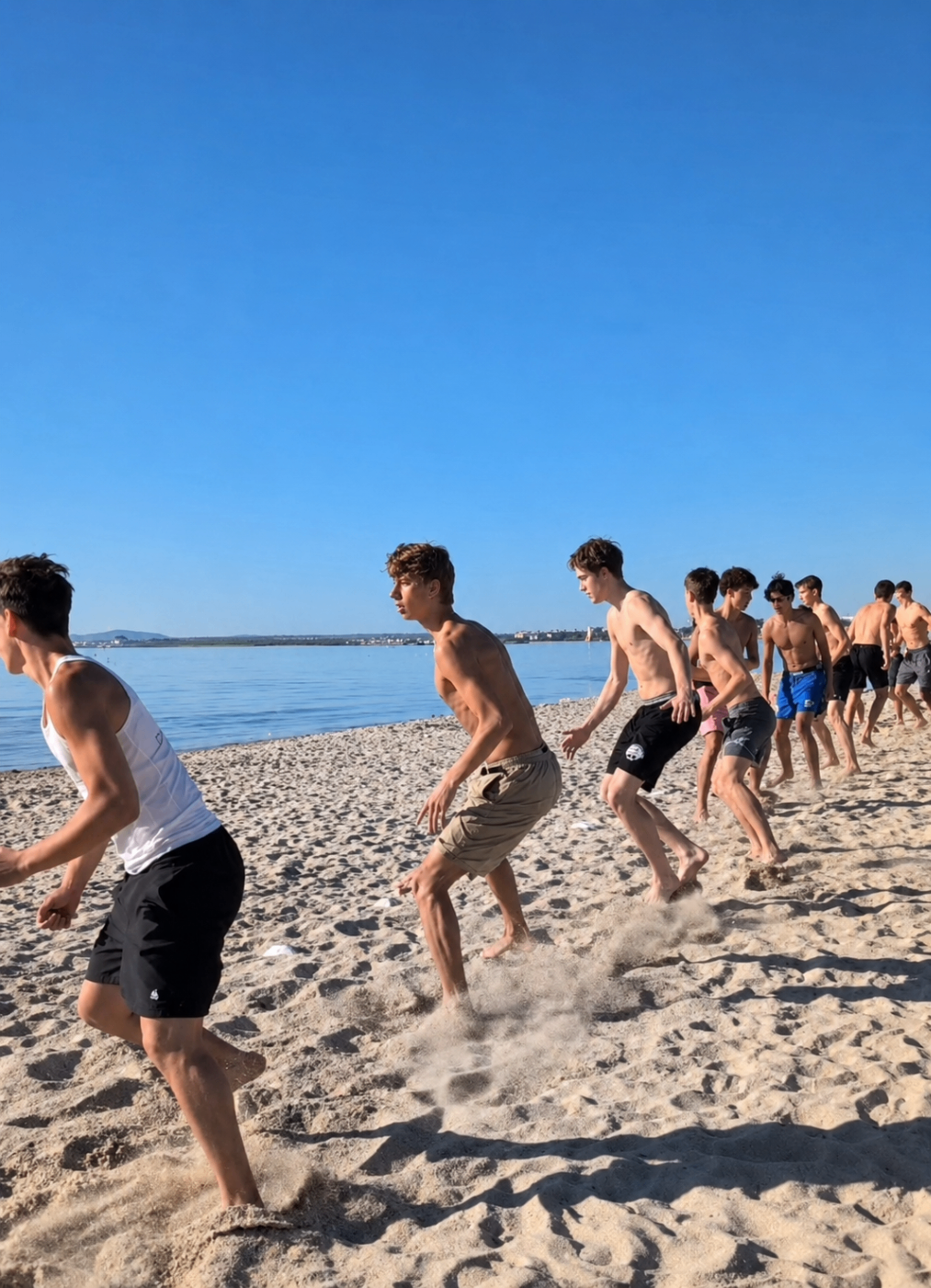 Players training together on the beach in Mallorca